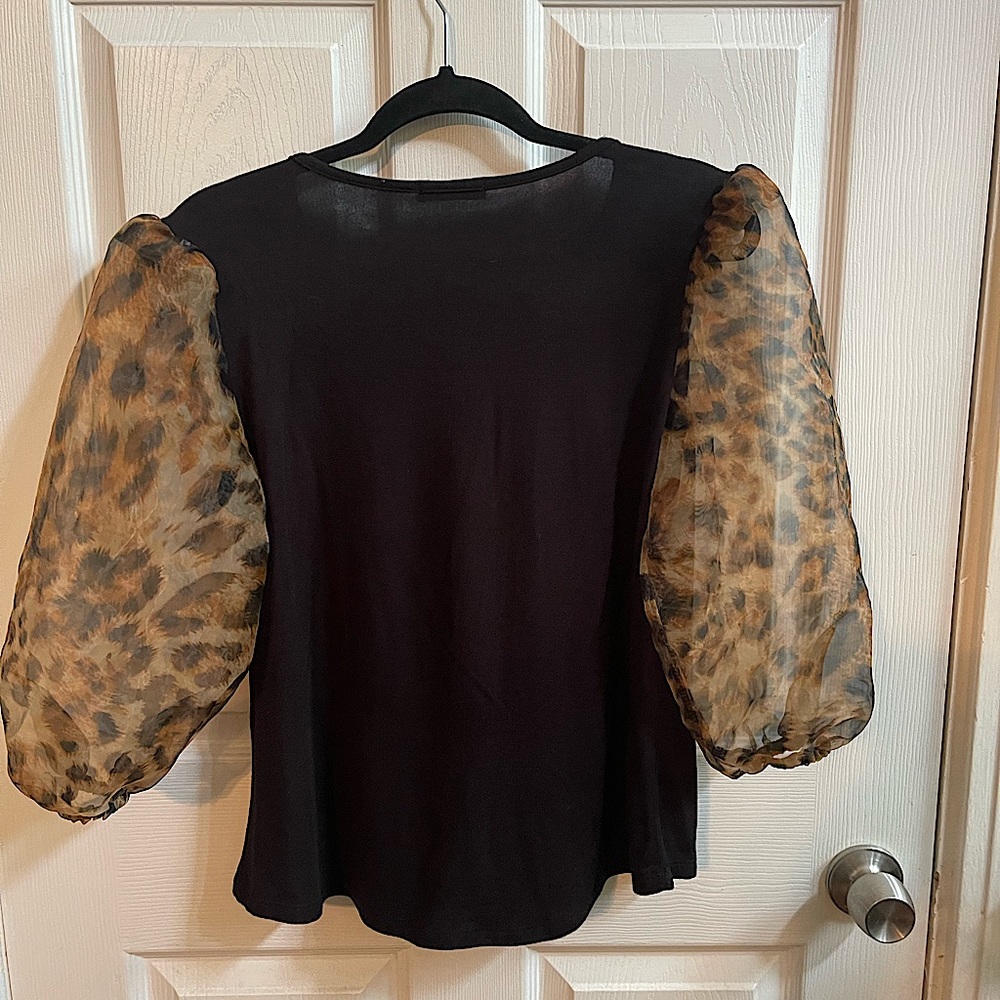 Pretty and stylish black blouse with sheer pouf animal print sleeves -